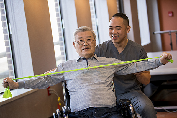 Korean man with resistance bands