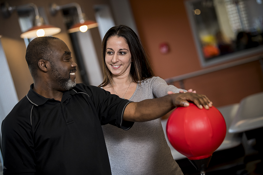 Therapist with man boxing